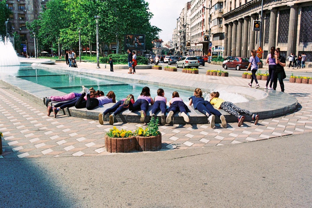 Children playing at the fountain Children playing at the fountain